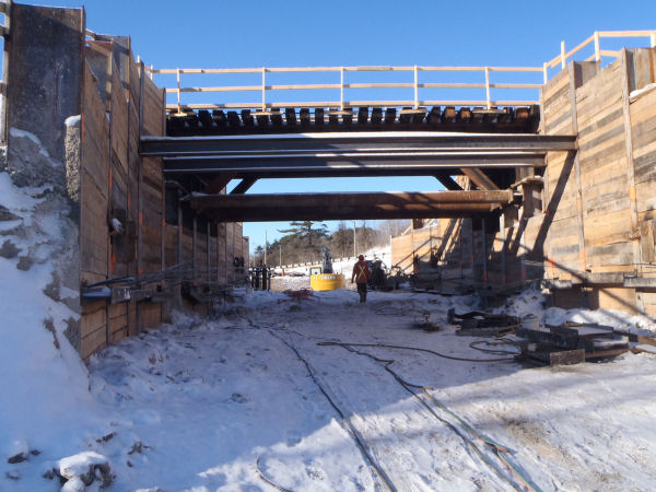 Mapleview shoring - Caisson Wall by RWH Engineering. RWH redesigned the shoring system to better suit excavation and bridge footing construction.